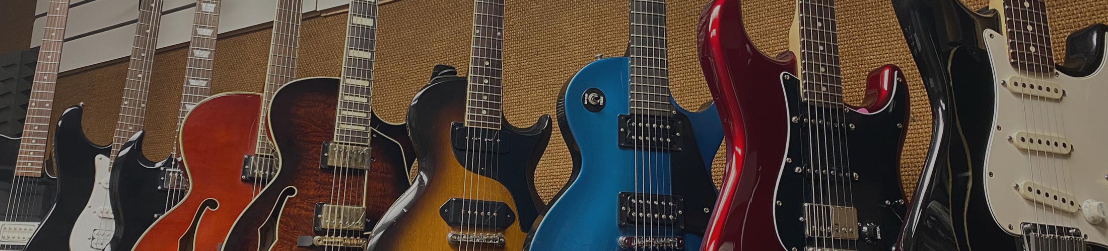 image of electric guitars hanging up in WestSide Music